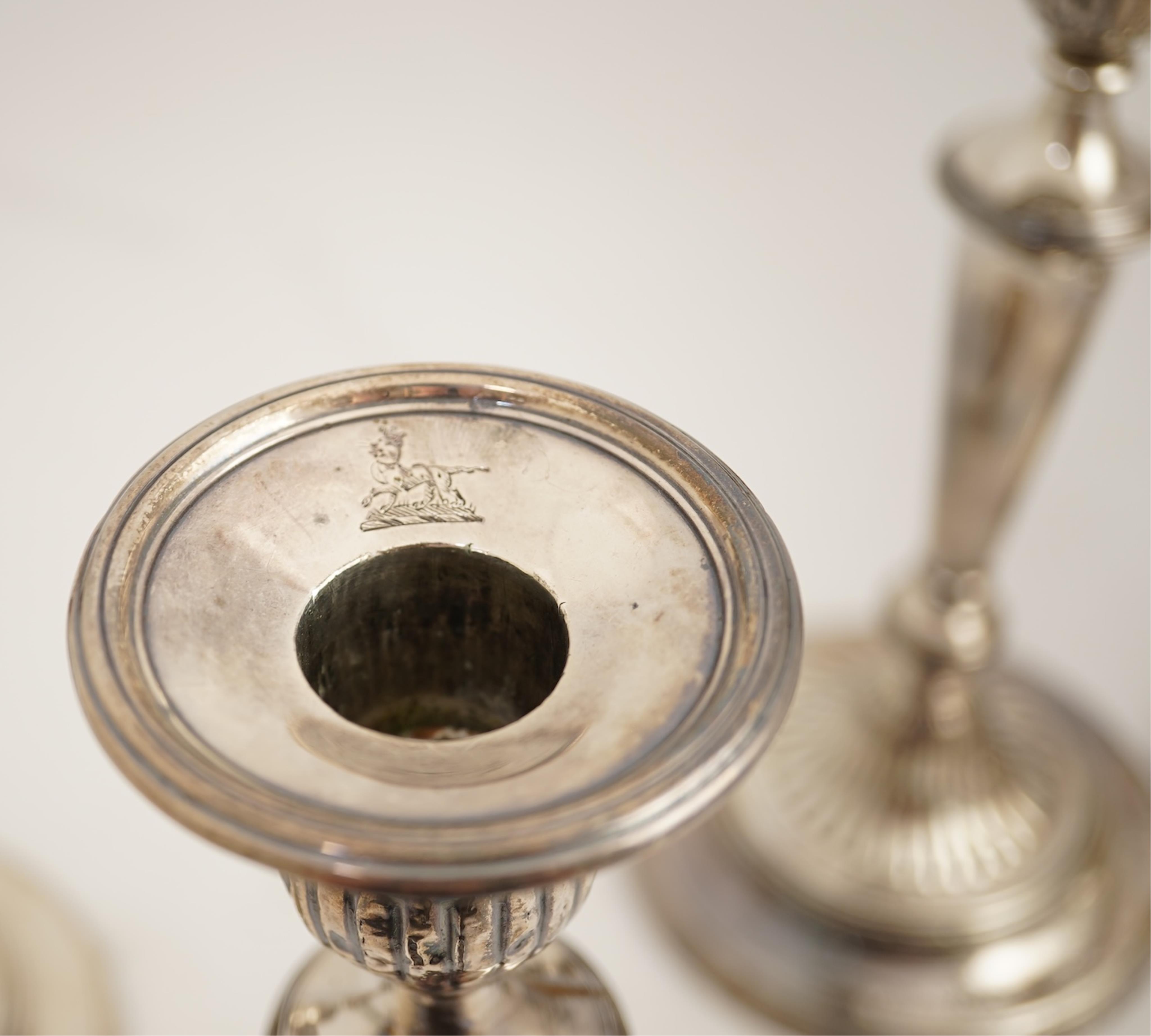 A set of four George III silver candlesticks by John Green, Roberts, Mosley & Co, with waisted turned stems, on circular foot, Sheffield, 1801, (repair), 27.5cm, loaded.